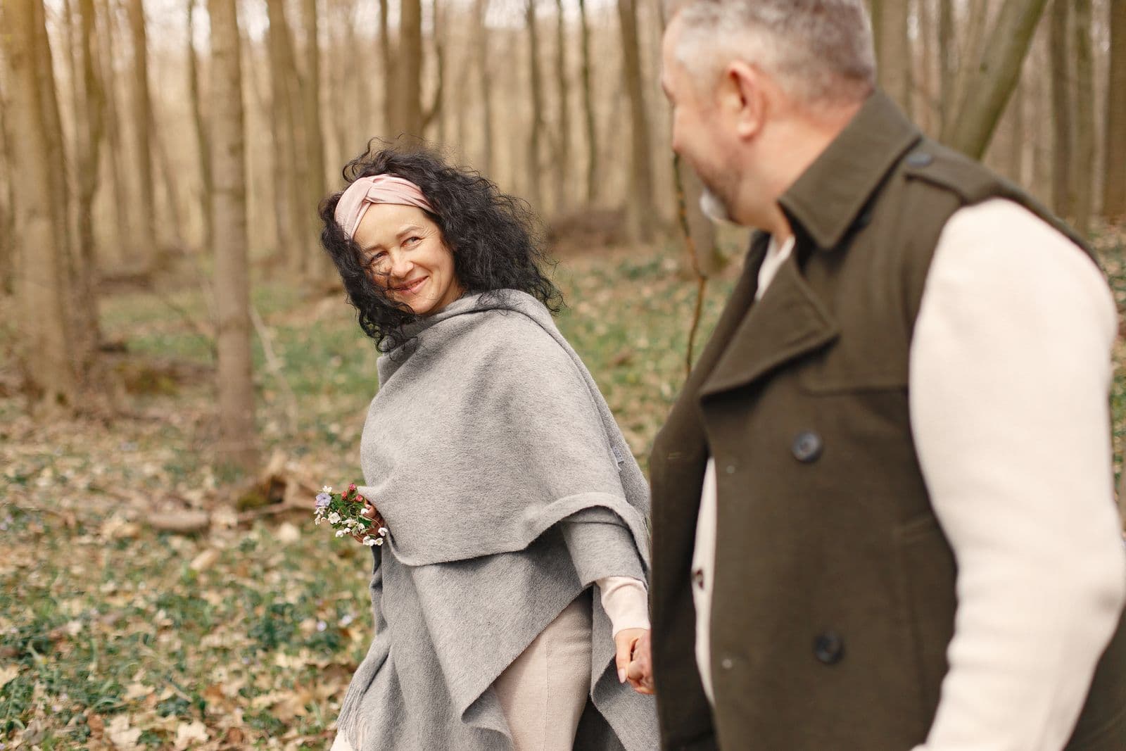 Retired couple walking together outdoors